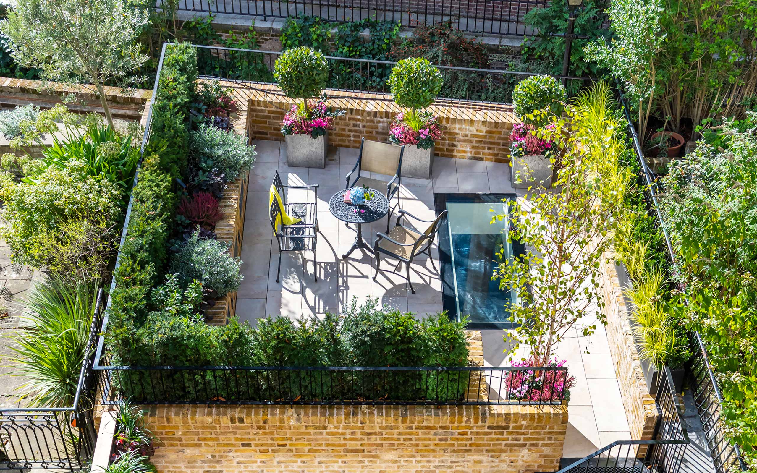 Knightsbridge minimalist garden above swimming pool by Maïtanne Hunt